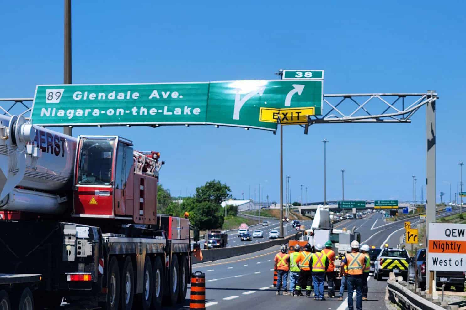 dump truck hit sign qew